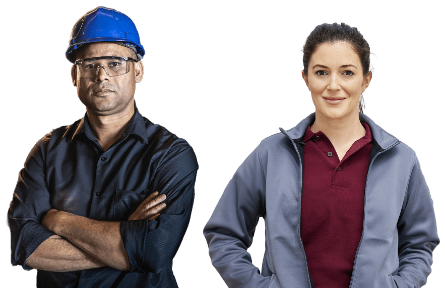 Man with crossed arms, hard hat, and safety glasses next to woman with polo and jacket